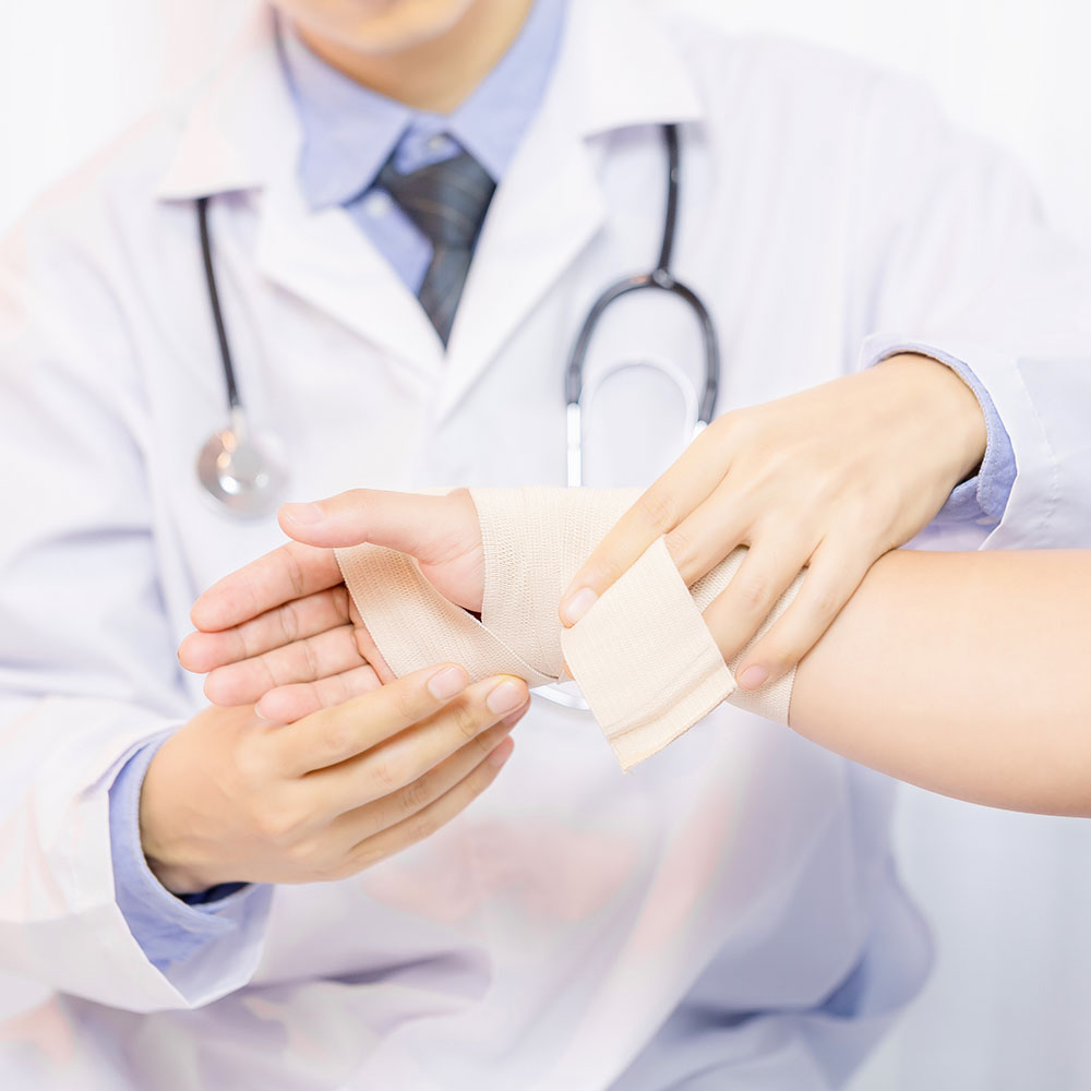 Specialist applying bandage for chronic wound care in Reno at Atrium Woundcare